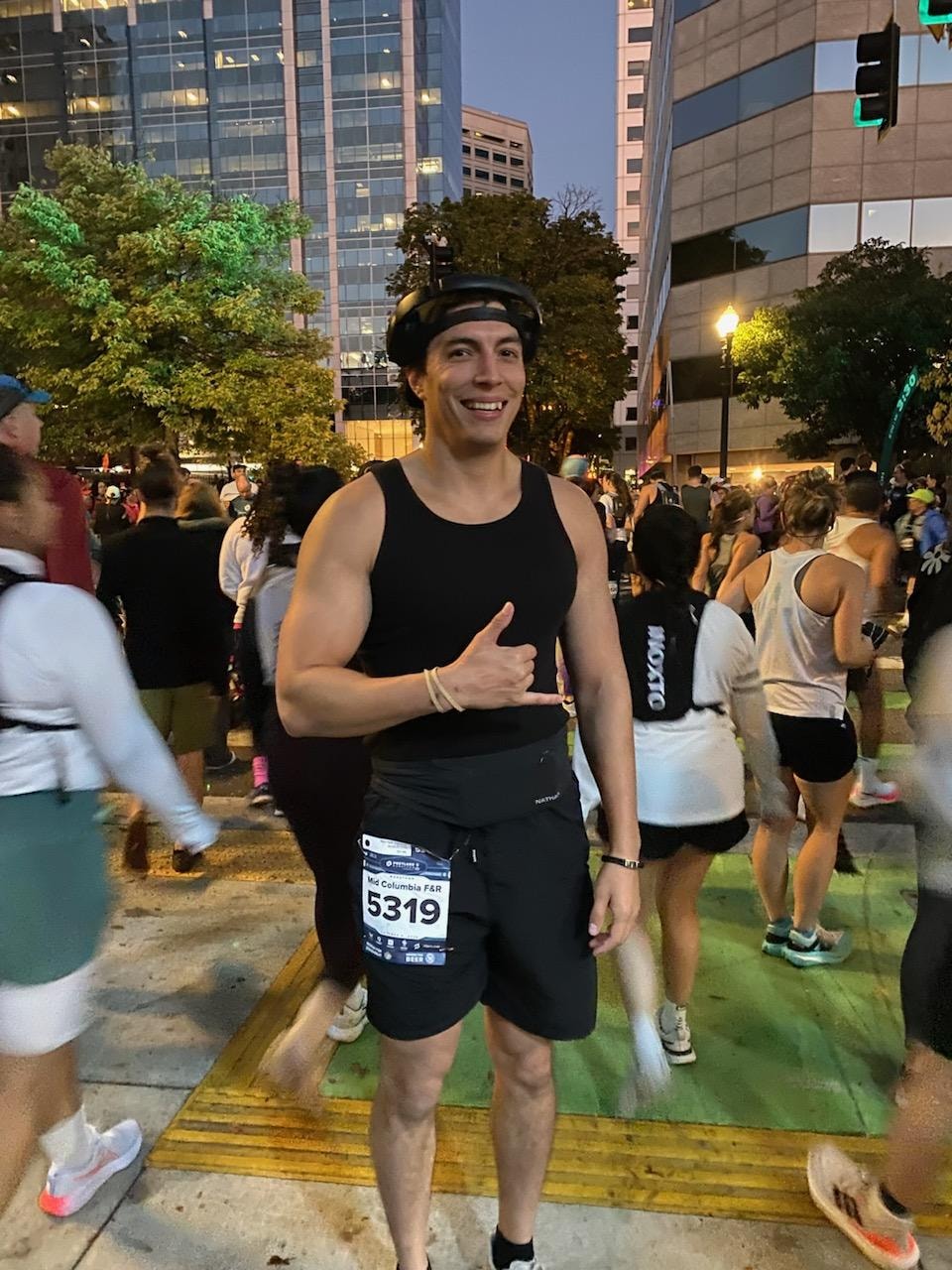 Eddie racing at a night running event, bib number 5319
